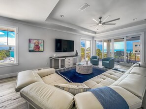 Sit back and relax from the 3rd level living room!  Sliders to the ocean view balcony with outdoor seating!