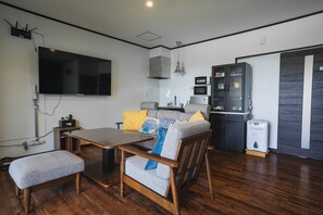 There is a kitchen in the living room.