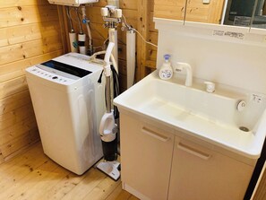 There is a washing machine in the room. *Detergent not included