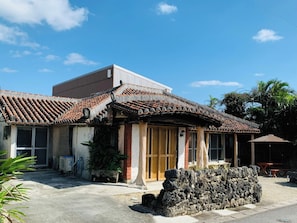・Main building exterior: An old-fashioned house with a distinctive red tile roof