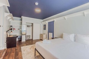Enjoy a restful sleep and a productive workday in this comfortable bedroom with a closet and desk.