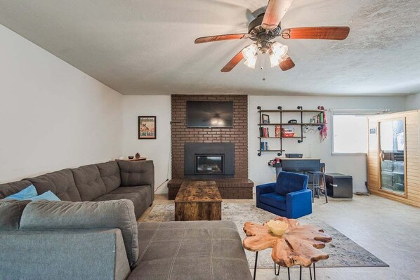 Curl up on our comfy L-shaped sofa and enjoy the warmth of the fireplace.