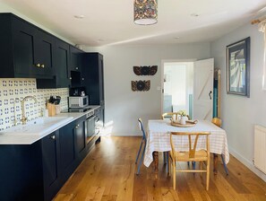 Open-plan kitchen living room with triple aspect