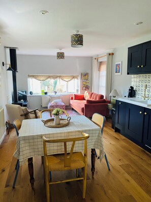 Open plan kitchen living room with sofa bed