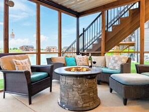 Families can gather here by the beach or the porch fire pit…