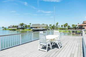 Watch the birds and boats go by from the uncovered deck