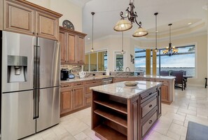 Featuring an oversized kitchen island, ample counter space, and top-of-the-line appliances, this kitchen is the gold standard for kitchens!