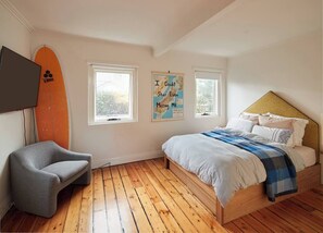 Snuggle into a cloud-like queen-sized bed in this tastefully furnished bedroom. 
