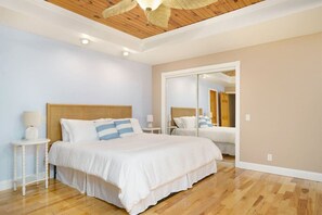 Upstairs Primary bedroom with private balcony and bathroom