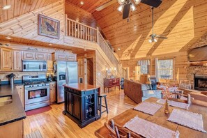 The Great Escape | Incredible Smoky Mountain Views | Inviting Living Room with Plush Furnishings  | Open-Concept Design with Seamless Flow to the Kitchen and Dining Areas | Gas Fireplace for Cozy Evenings 