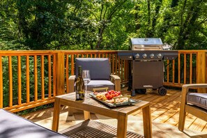 The balcony deck has a bbq grill