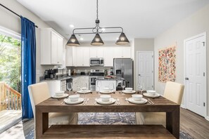 Dining area with table setup for 8