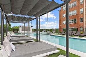 Common area, zero entry pool with loungers and cabanas