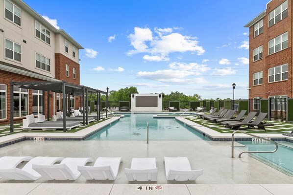 Common area, zero entry pool with loungers and cabanas