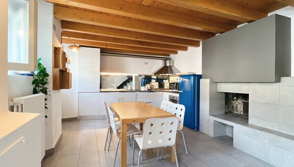 Bright kitchen equipped with dining table