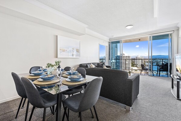 Dining area is right next to the living area and the balcony