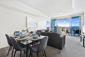 Dining area is right next to the living area and the balcony