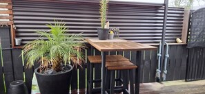 Bar leaner under covered area