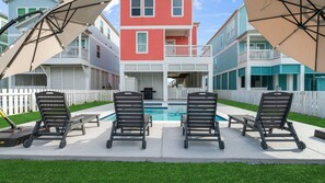 Loungers surrounding the serene pool and spa
