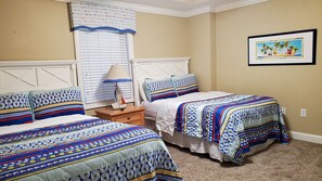 Bedroom number three with two double beds