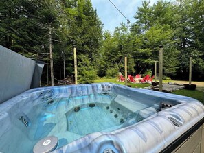Warm up in the hot tub—a cozy retreat perfect for chilly nights!