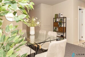 Savor a home-cooked meal or takeout in this stylish dining area, perfect for both casual dinners and special occasions.