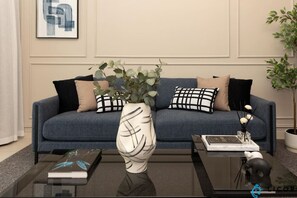 Relax in the chic and cozy living room, featuring modern decor, plush seating, and beautiful accents that create a welcoming atmosphere.