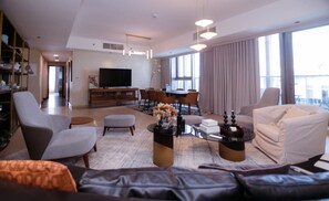 Relax in this bright, open living space, perfect for unwinding after a day of exploring Dubai. Complete with comfortable seating and modern amenities.