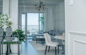 Open-plan living and dining area with elegant decor and plenty of natural light.