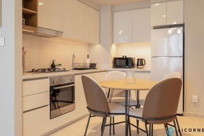 The fully equipped kitchen features modern appliances and ample counter space, making meal preparation a breeze.