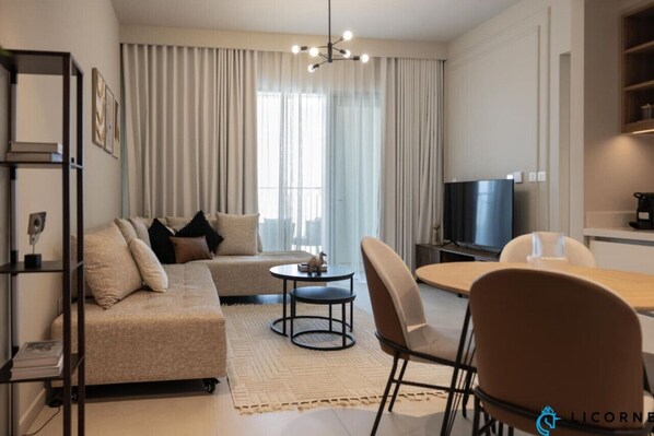 Enjoy modern entertainment in this chic living room, equipped with a smart TV for your viewing pleasure.