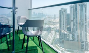 Relax and recharge – our balcony with two chairs and a coffee table offers a tranquil retreat with a lovely view.