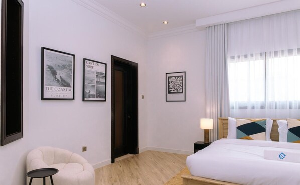 Bright and cozy bedroom with stylish décor and a comfortable king-size bed.