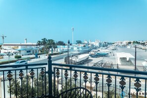 Enjoy views of the marina and the vibrant surroundings from your private balcony.