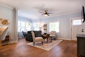 Unwind in style! This cozy living room is the perfect place to relax after a day of exploring. It's the ultimate comfort zone with soft seating, ample natural light, and a touch of modern décor.