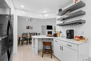 Beautifully appointed kitchen which opens to the living space