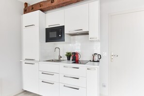 The kitchen is fully equipped to prepare a simple meal