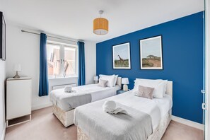Bedroom 2 has a zip link bed which is configured as two single beds by default or can be zipped together to form a king-size bed upon request. Fresh linen and towels are provided.