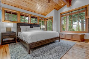 Bedroom 1: King bed, walk-in closet, dresser, 42” Smart TV, fireplace, en suite bath, upper floor