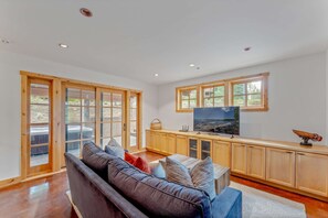 Bonus Room: Couch, twin-over-twin Murphy bunk beds, 50” Smart TV, access to patio and hot tub, ground floor