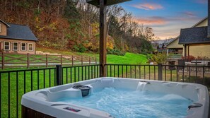 Hot tub on first floor deck for relaxing after a long day of games, hiking or shopping