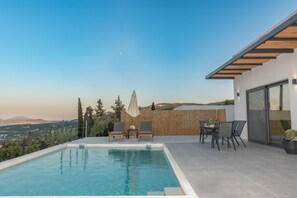 Find your paradise by the poolside, surrounded by lush greenery.