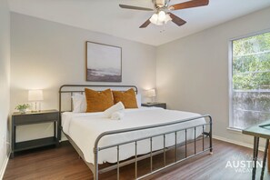 King bedroom on the main floor with luxury linens and tv