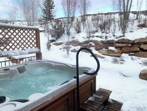 beautiful hot tub with snow