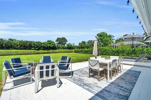 The spacious backyard lanai has multiple seating options for guests