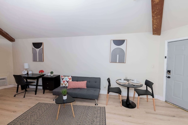 Living and dining area with remote-work friendly space