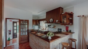 Rustic yet fully equipped kitchen, perfect for creating home-cooked meals in a classic setting. #RusticKitchen #ClassicLiving