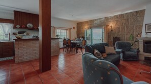 Charming rustic living room with cozy seating and classic decor, perfect for unwinding after a day of exploring. #RusticCharm #CozyLiving