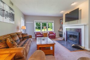 Spacious living room w wood-burning fireplace!