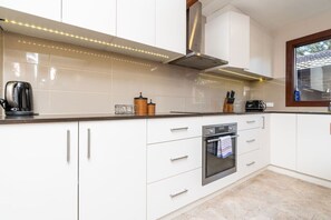 Sleek and modern kitchen featuring state-of-the-art appliances for your culinary needs.